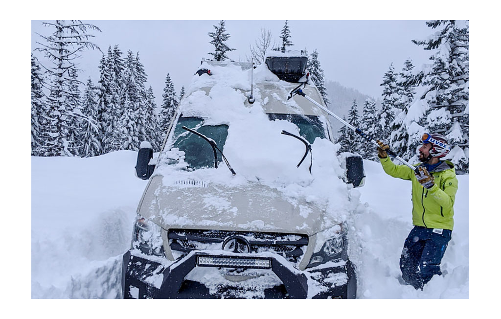 Winnebago Revel being dug out of deep snow.