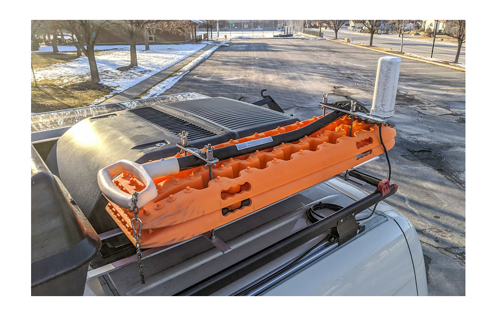 Recovery tracks and shovel on rack on top of Winnebago Revel.