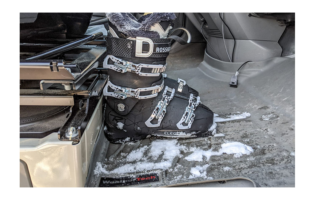 Snow boots on WeatherTech floor mat in Winnebago Travato.