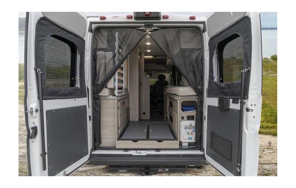 Back doors of Winnebago Solis open to show a view of the inside.