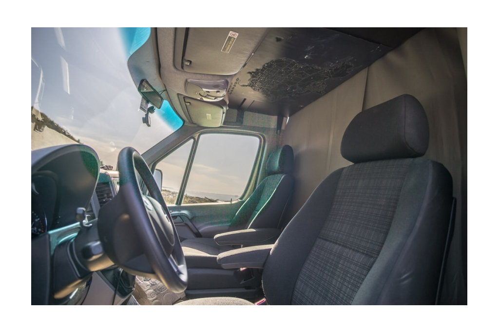 Front interior cab view of black out curtains in Winnebago Revel