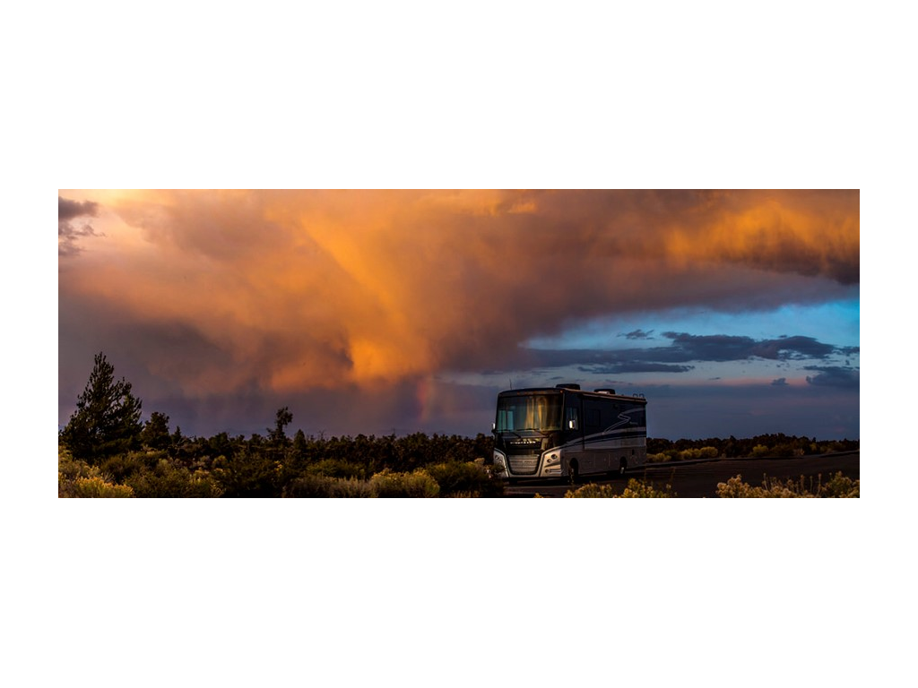 Bright sunset above Adventurer in green field