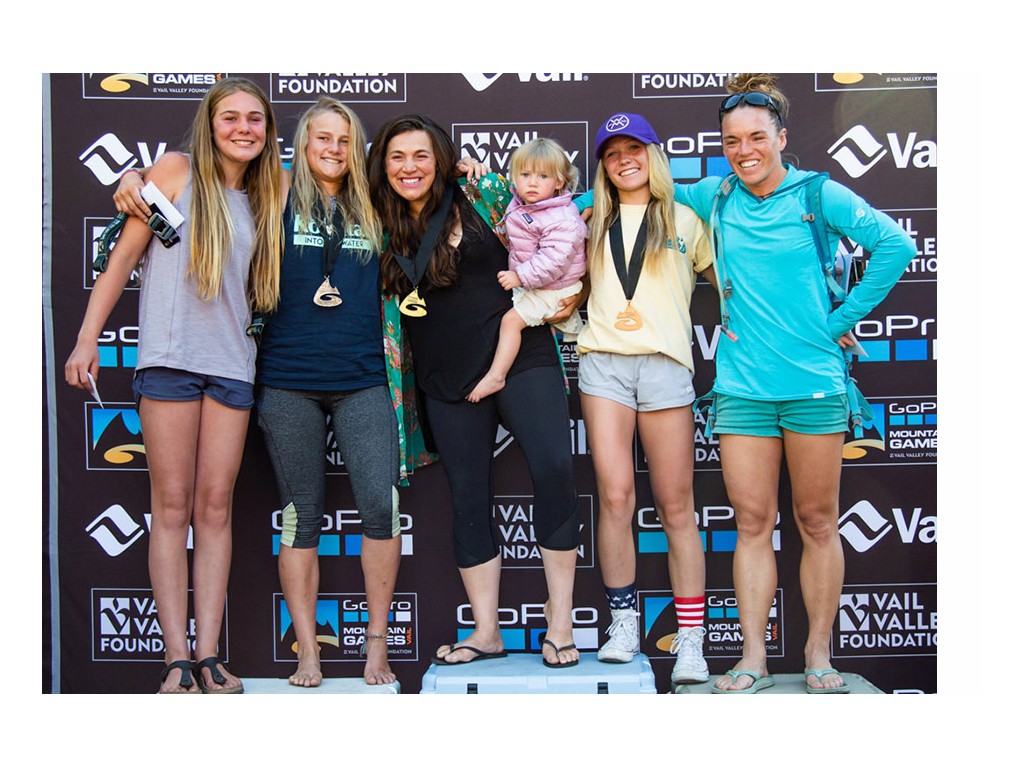 Abby with other kayakers standing at podium for 2018 freestyle kayaking
