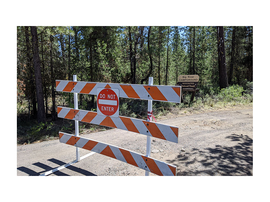 Barricaded road of closed campground