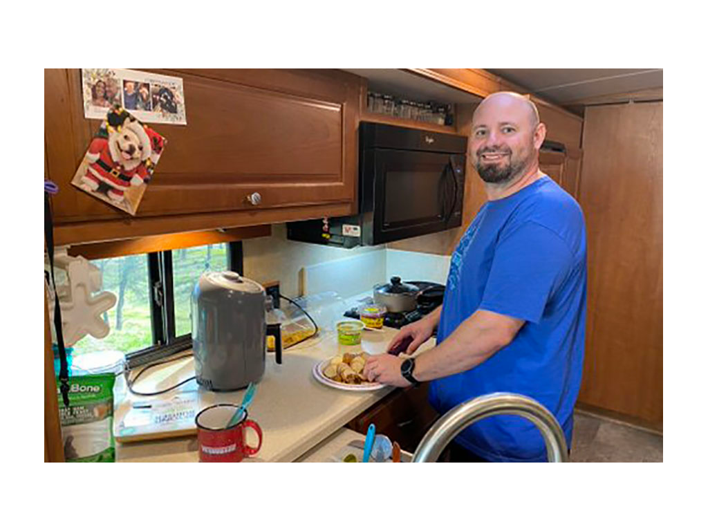 Kenny cooking in Winnebago Vista