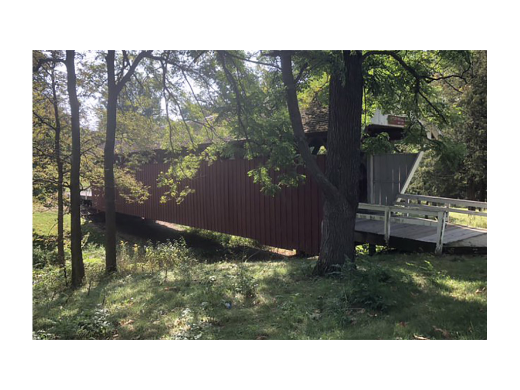 Cutler Donahoe Bridge surrounded by green trees