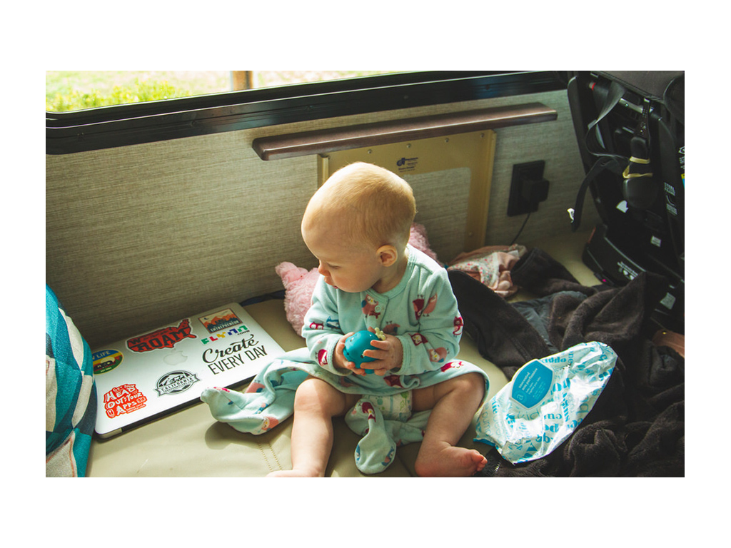 Ellie sitting of Forza sofa holding a toy
