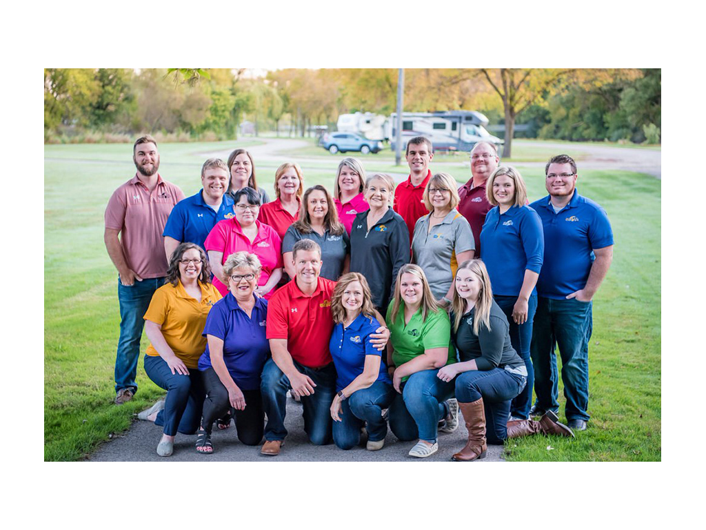 FCIS insurance team huddled together for a photo outside