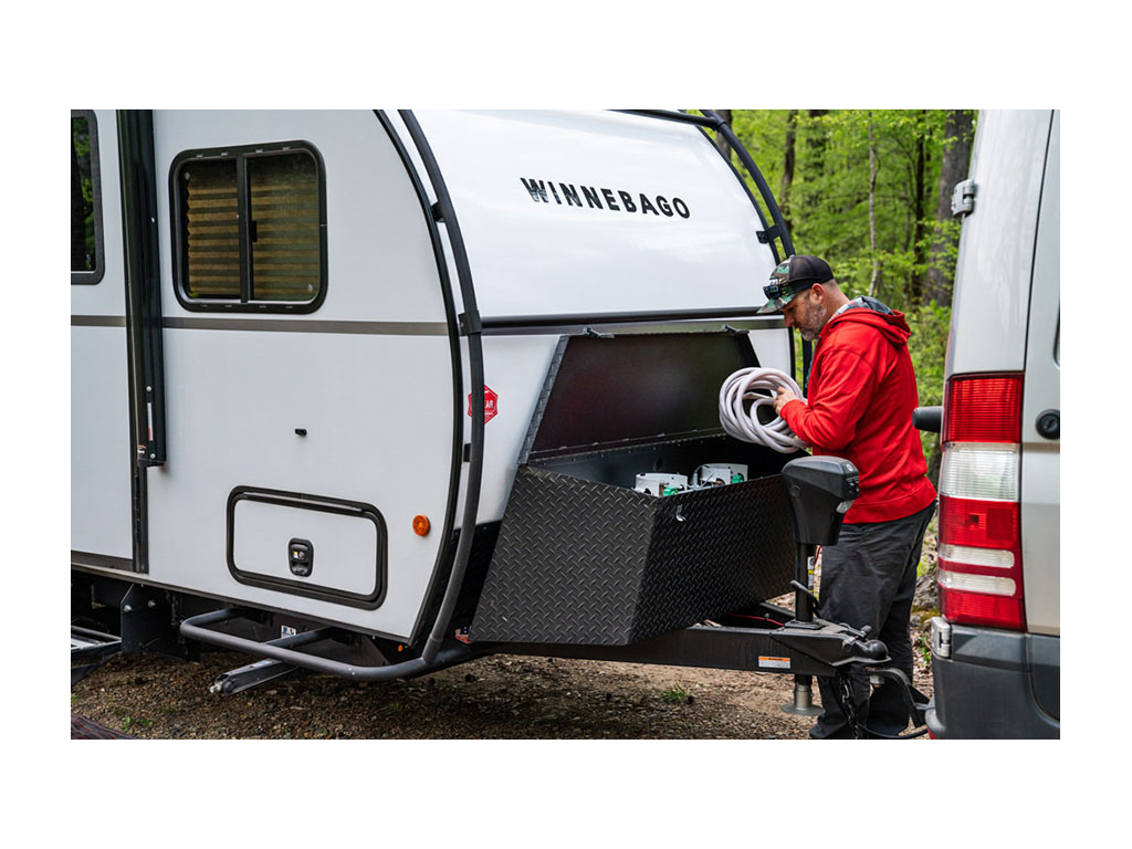 Peter taking out water hose from HIKE tongue box