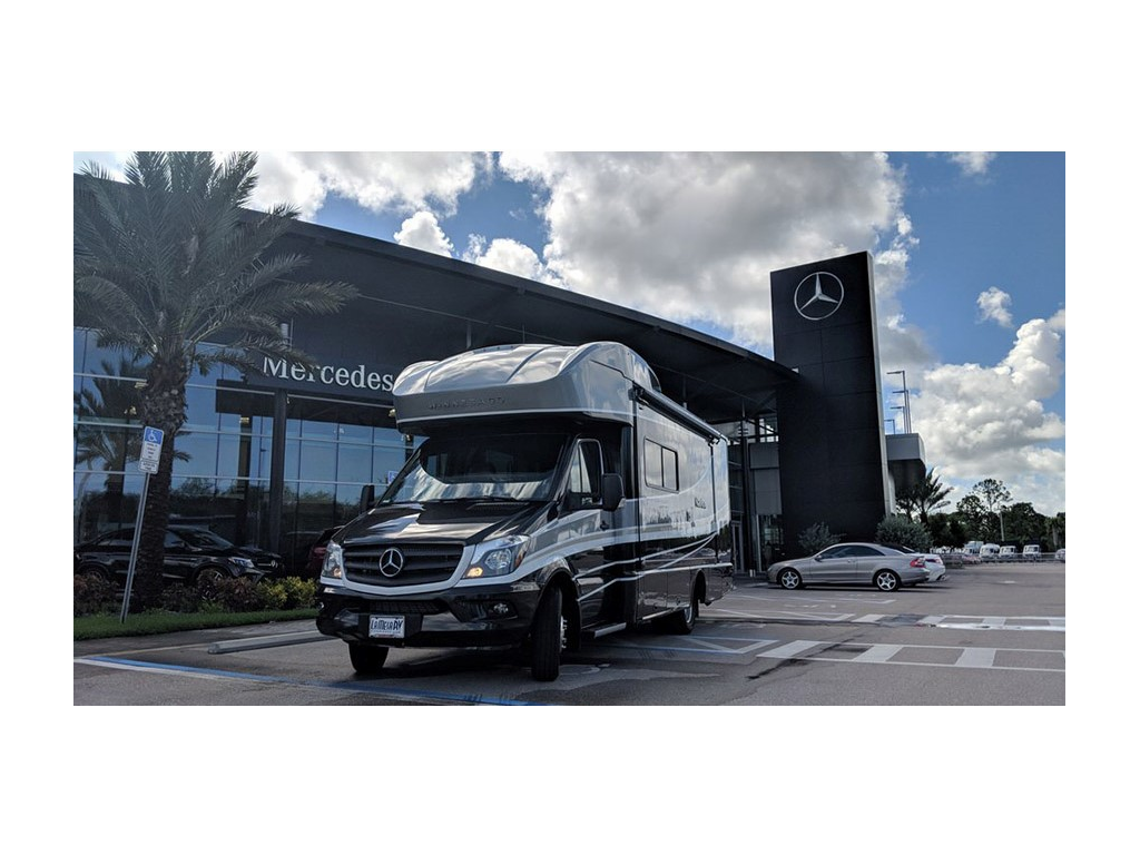 Navion parked in front of Mercedes dealer