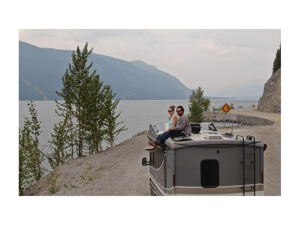 Newstates sitting on top of Navion overlooking water