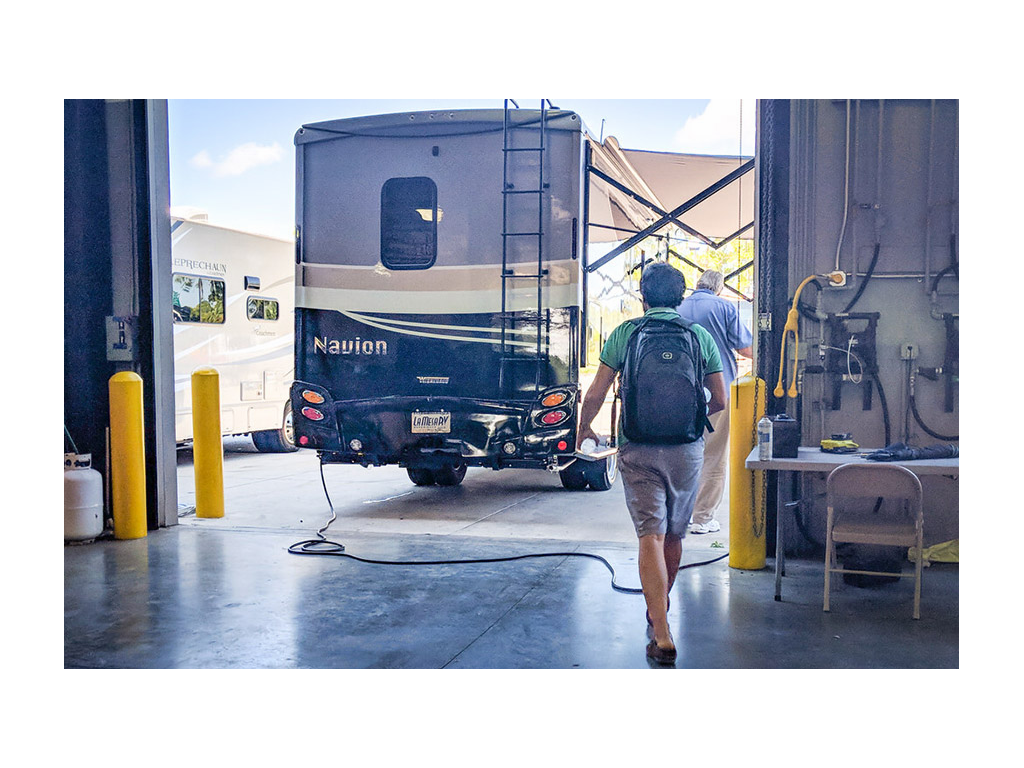 Howard walking towards Navion in service bay