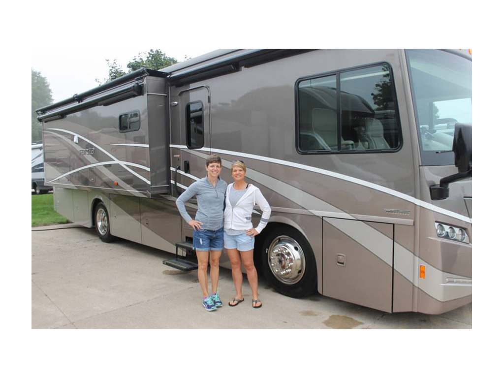 Ann and Lin standing in front of Forza posing for a photo