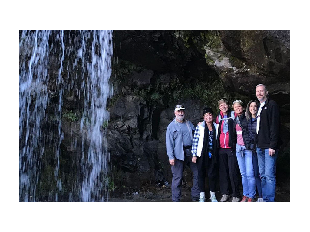 Ann and Lin with friends next to a waterfall in Great Smoky Mountains National Park