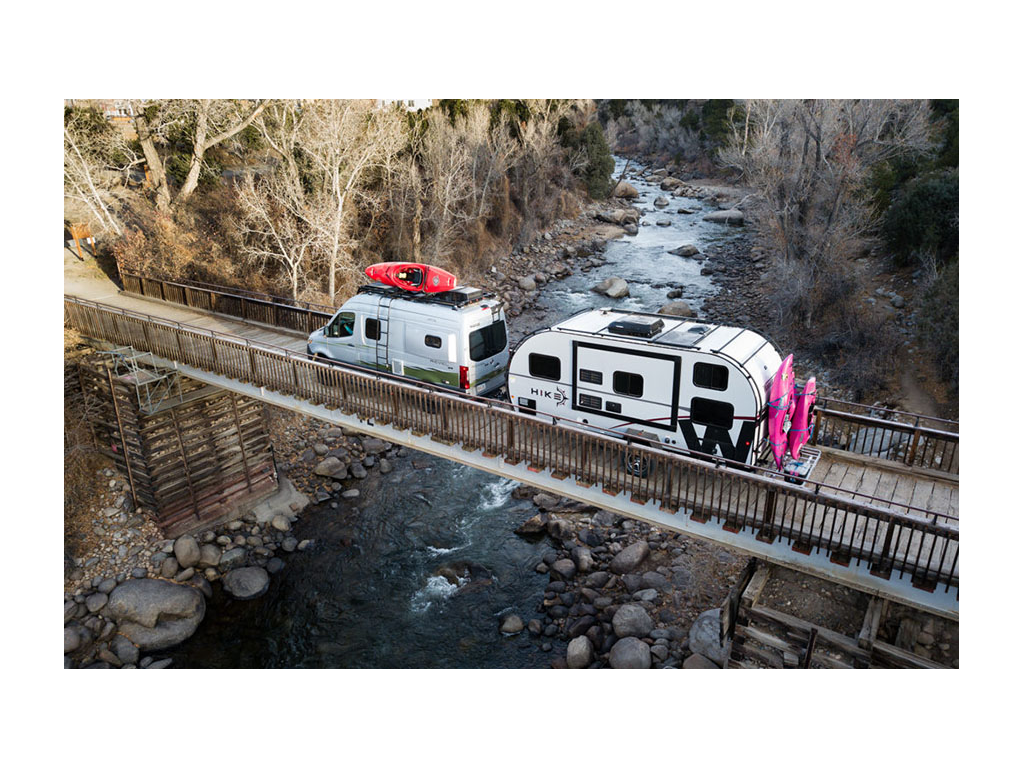 Revel pulling HIKE across bridge over water