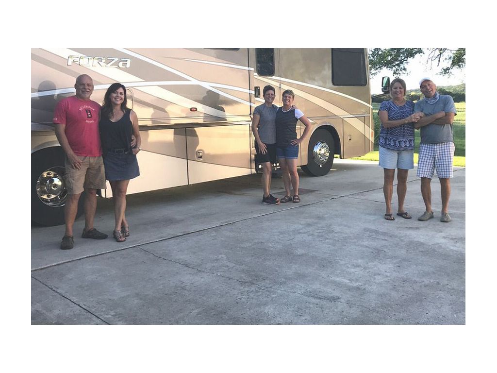 Ann and Lin standing in front of Forza with four friends standing at a distance