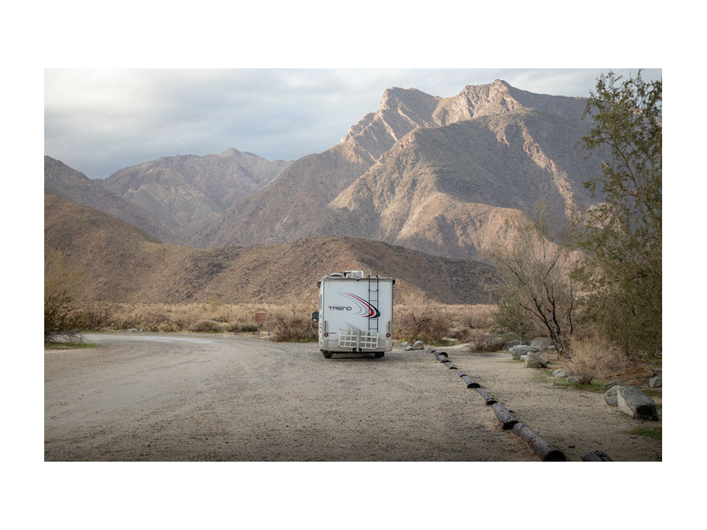 Back of the Trend parked next to mountains in California