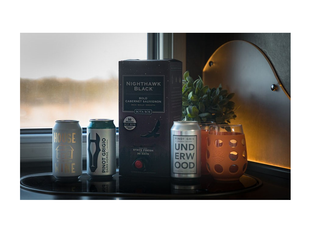 Canned and boxed wine sitting on countertop in Trend