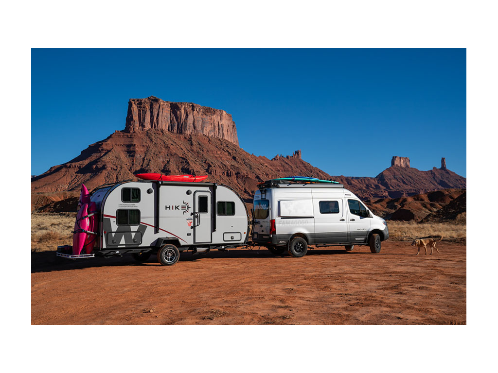 Winnebago Revel pulling Winnebago HIKE with red mountains in background