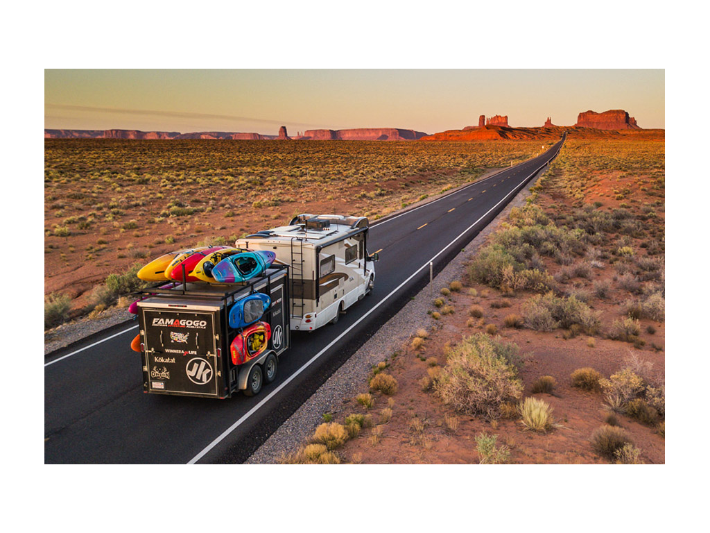 Winnebago View pulling trailer with kayaking gear