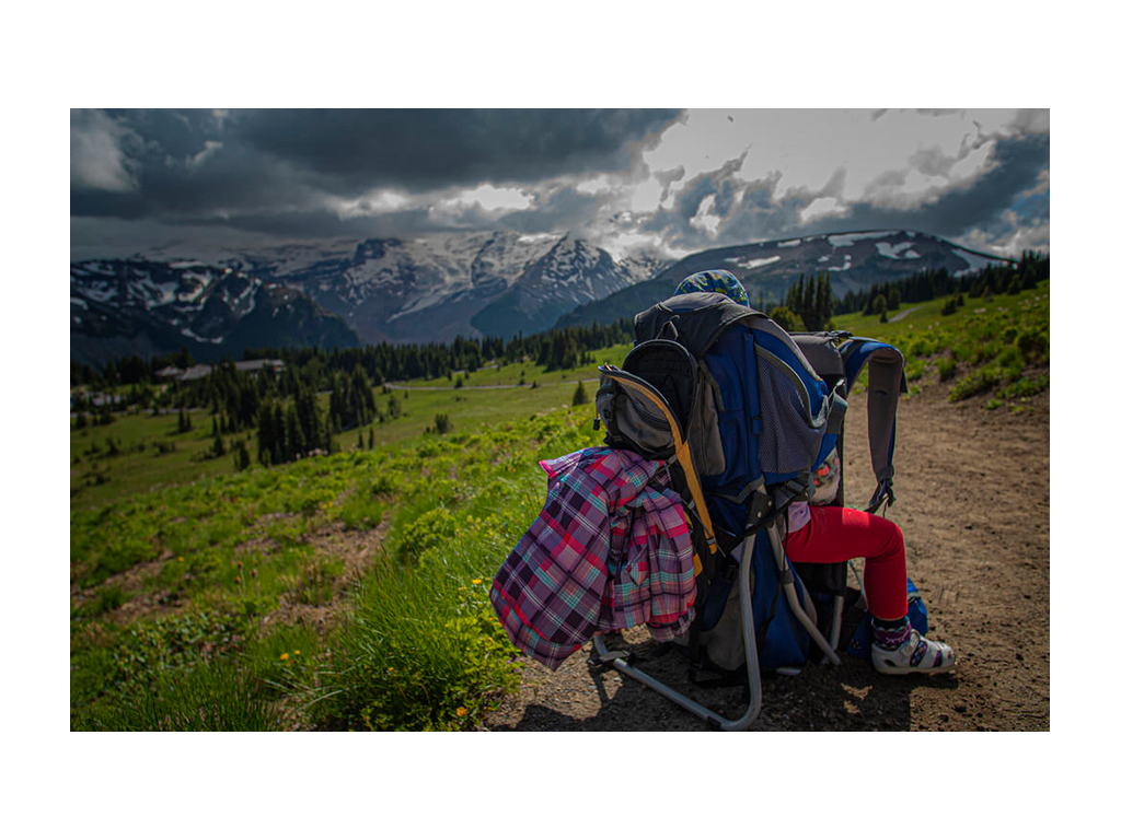 Isabelle sitting in child hiking backpack