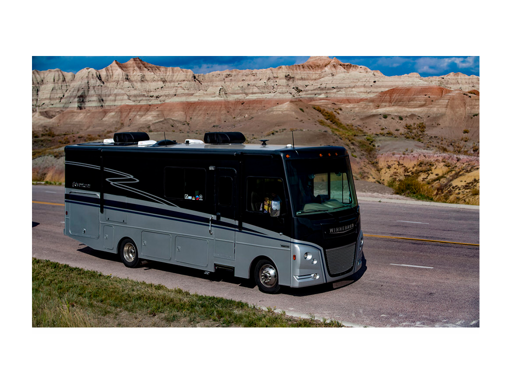 Adventurer driving through the colorful mountains of the Badlands