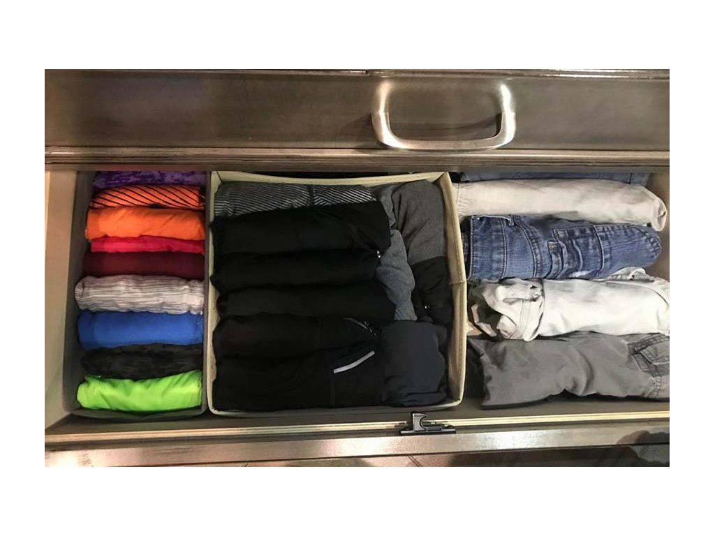 Drawer full of clothes folded using the KonMari folding method