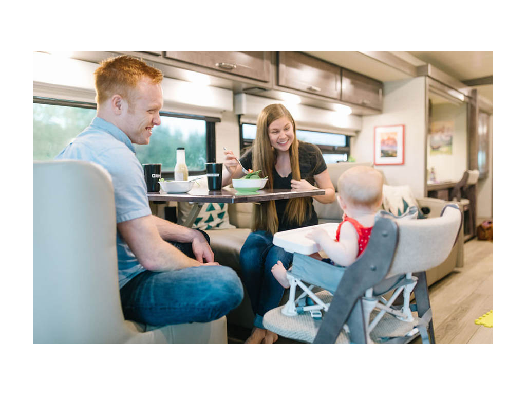 Alyssa, Heath and Ellie eating at dinette. Ellie is sitting in a high chair