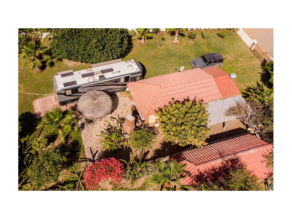 Aerial shot of Journey parked next to house