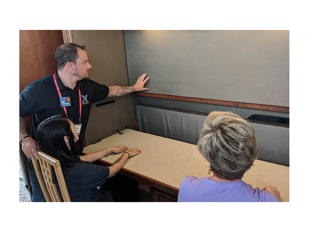 Travis and Melanie Carr testing out the desk