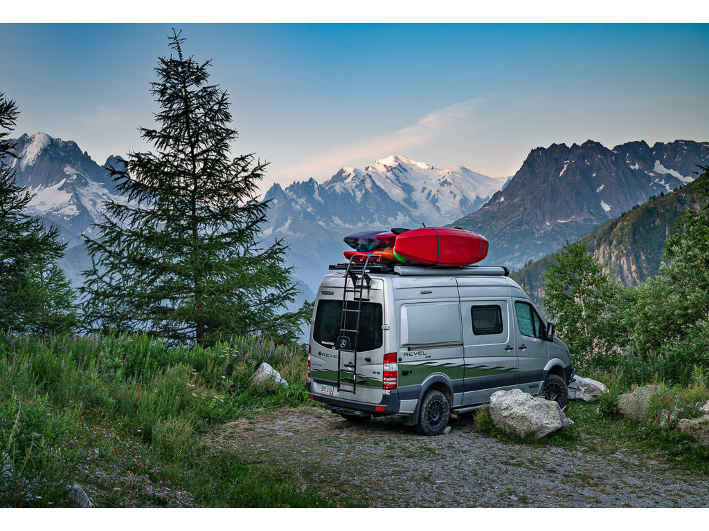 Winnebago Revel parked with the Swiss Alps in the background.