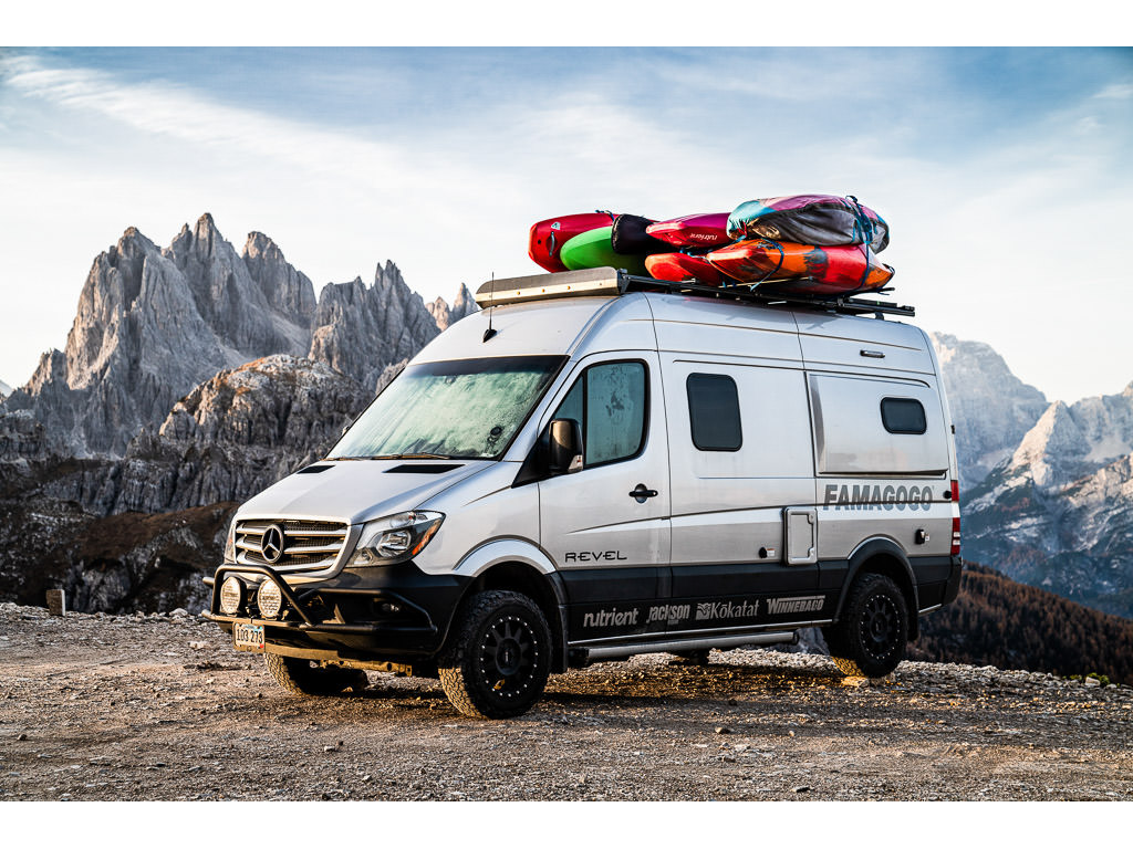 Winnebago Revel parked with Dolomites in Italy in background