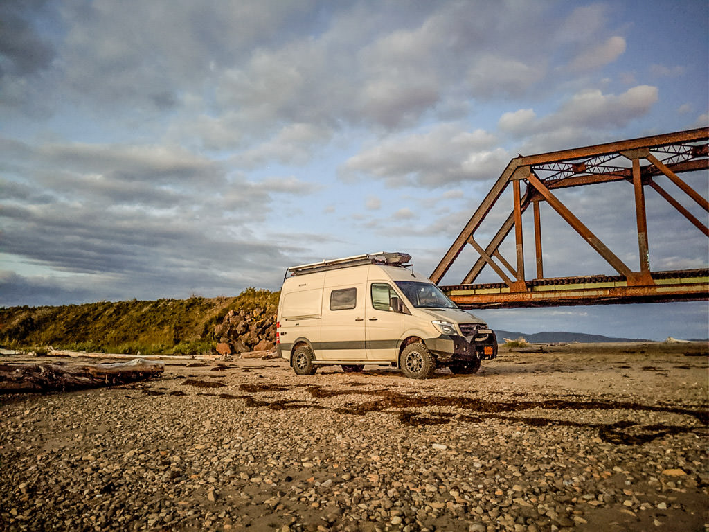 Winnebago Revel Parked beneath bridge at Gaspé Peninsula in Quebec, Canada