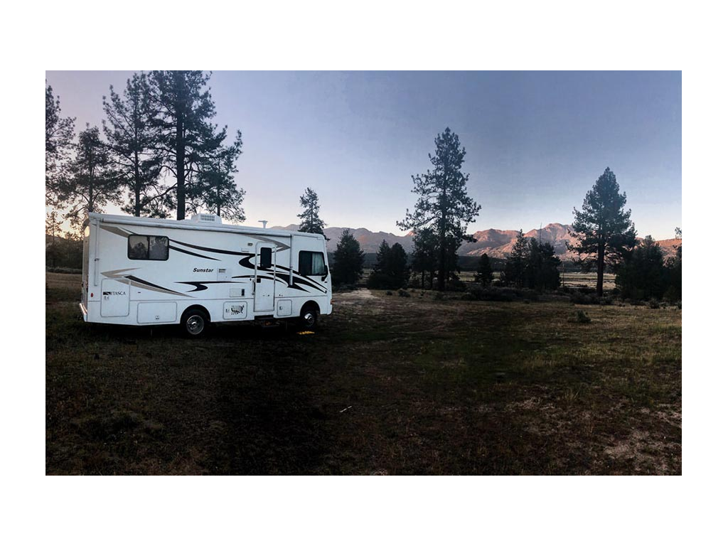 Sunstar with mountains in background
