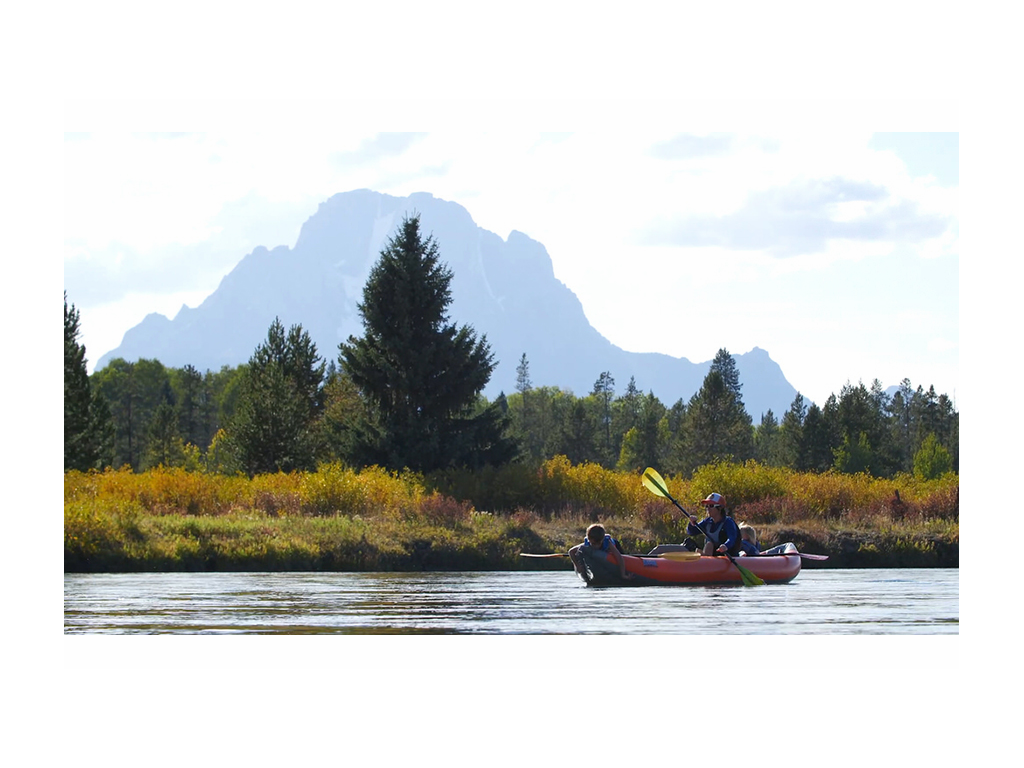 Kelly with kids in a kayak