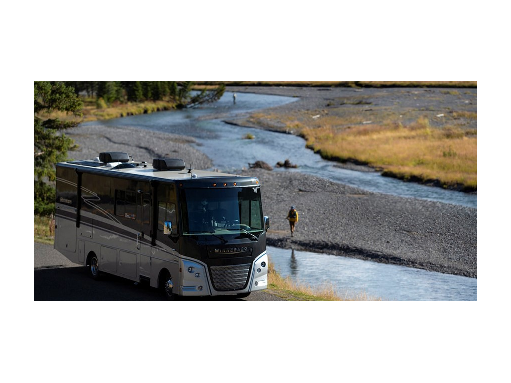 Adventurer parked next to river