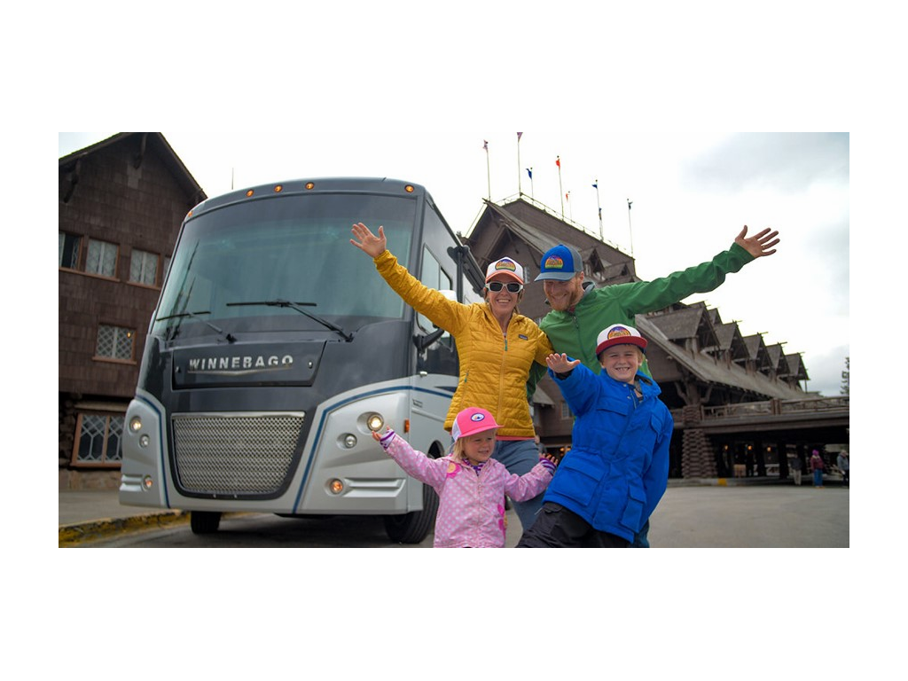 Pyke family in front of Winnebago Adventurer