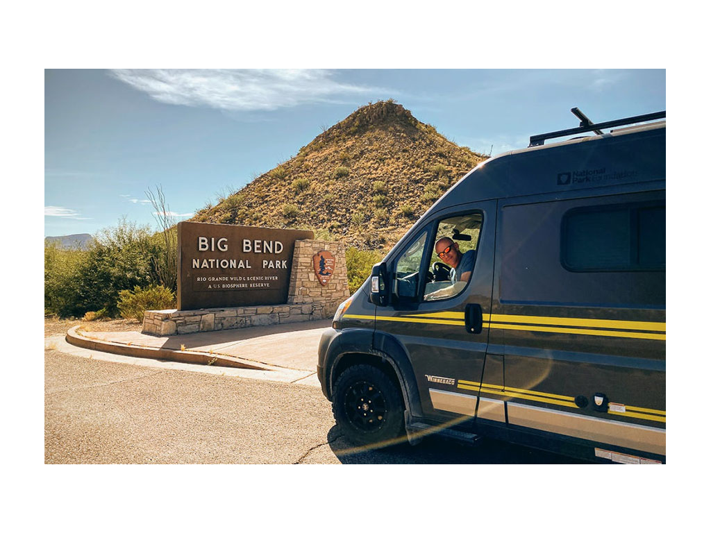 Limited Edition National Park Foundation Travato at entrance of Big Bend National Park
