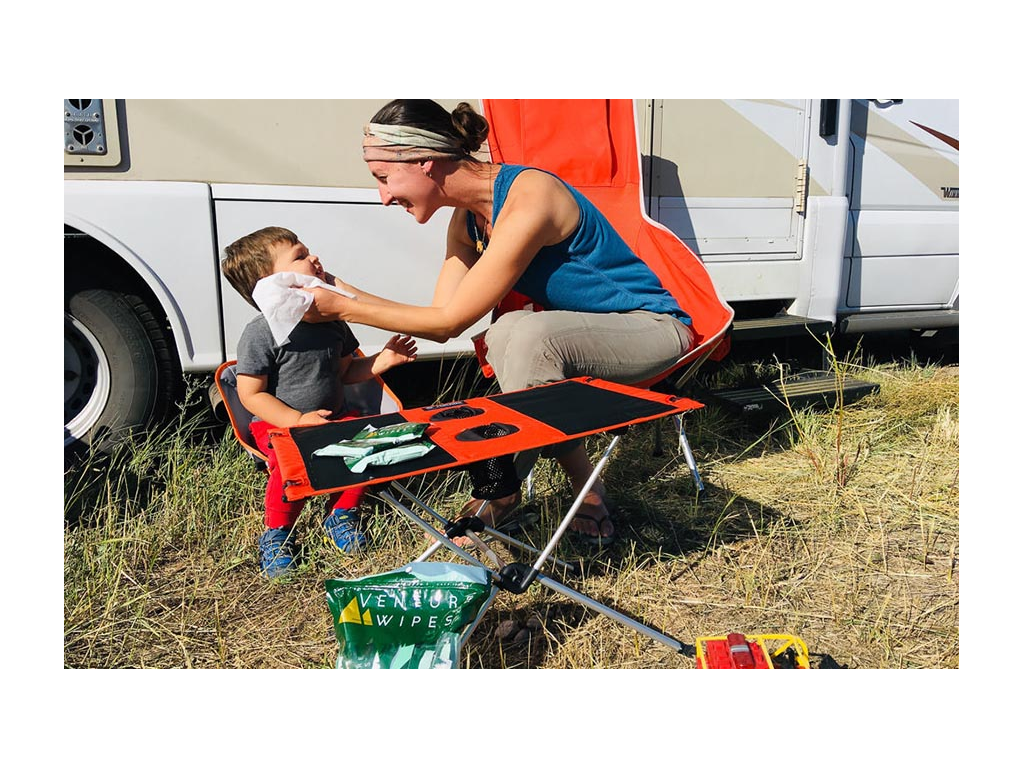 Brittany cleaning off Caspian's face while sitting outside of View