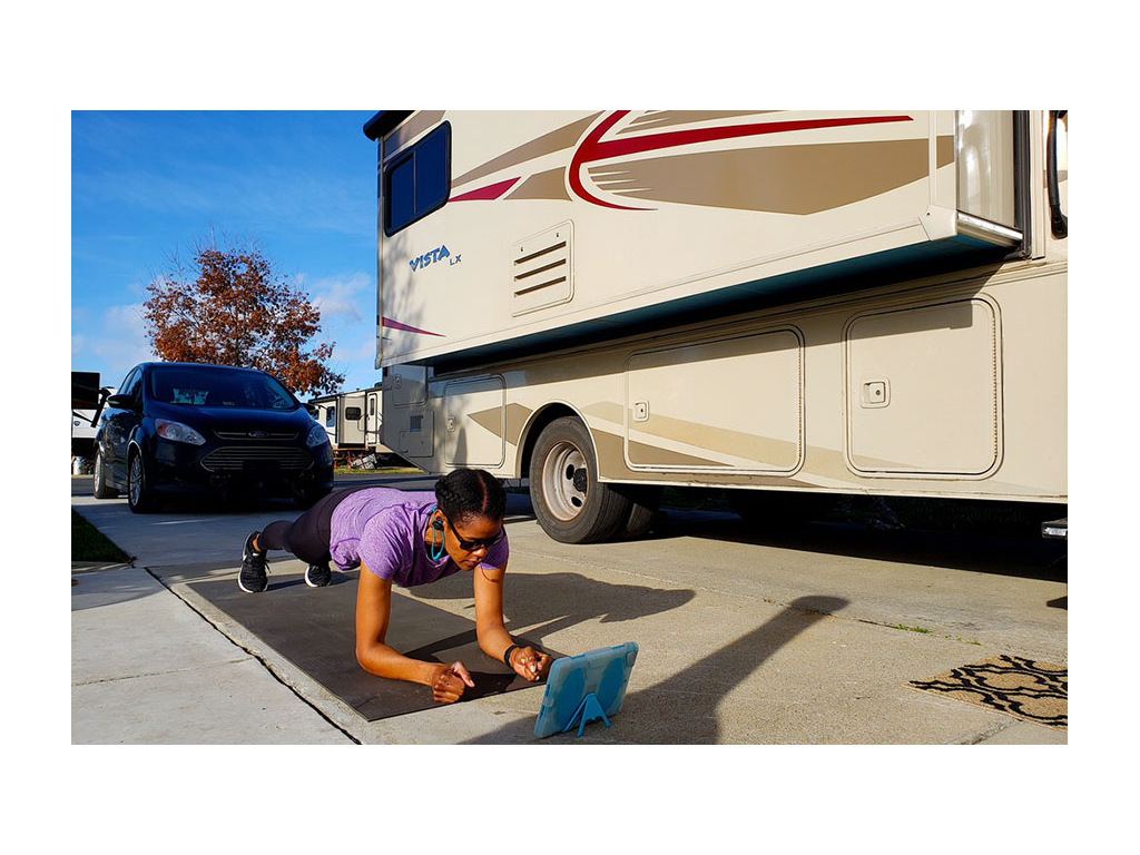 Sabrina doing a plank on yoga mat next to the Vista