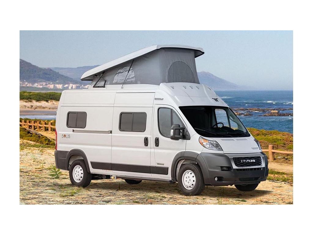 Winnebago Solis with pop-top up on the beach.