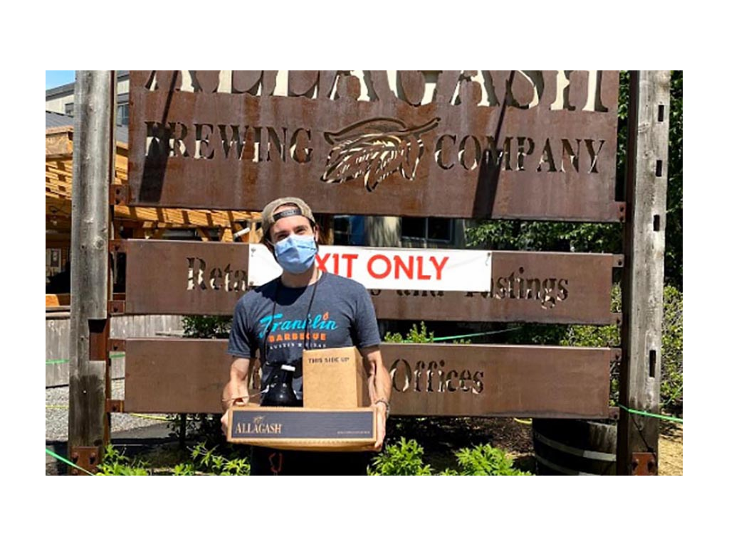 Mark holding box from Allagash Brewery in Maine