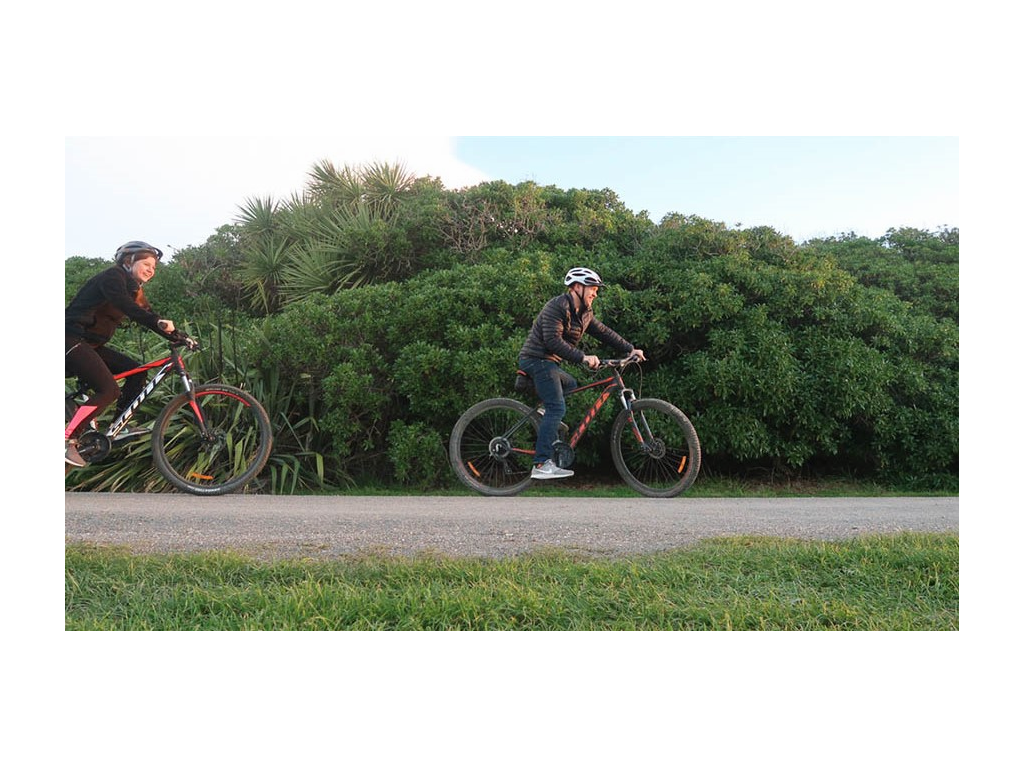 Alyssa and Heath riding bikes in New Zealand 