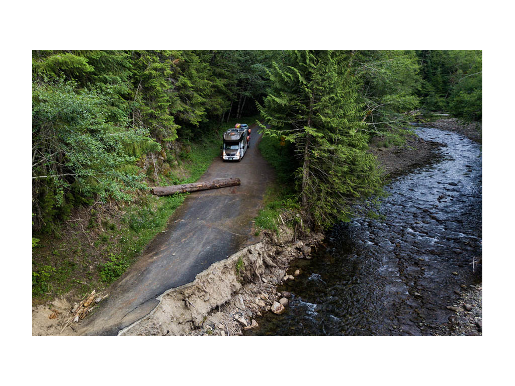 Winnebago View driving down road blocked by fallen tree