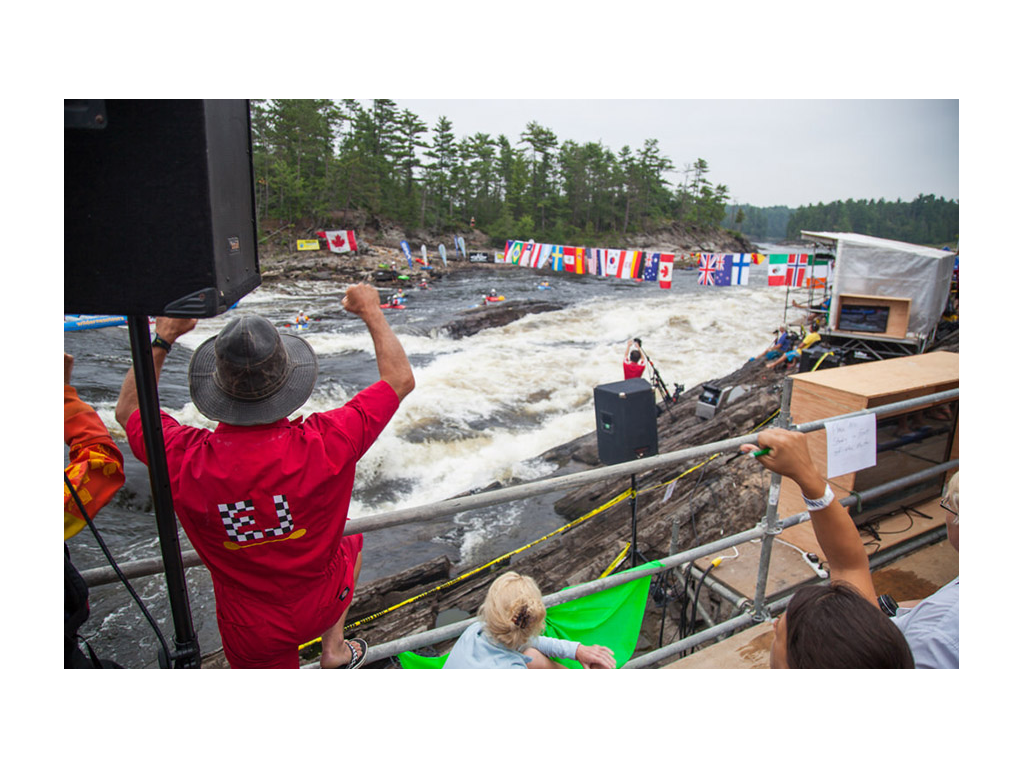 Crowd cheering on freestyle kayakers