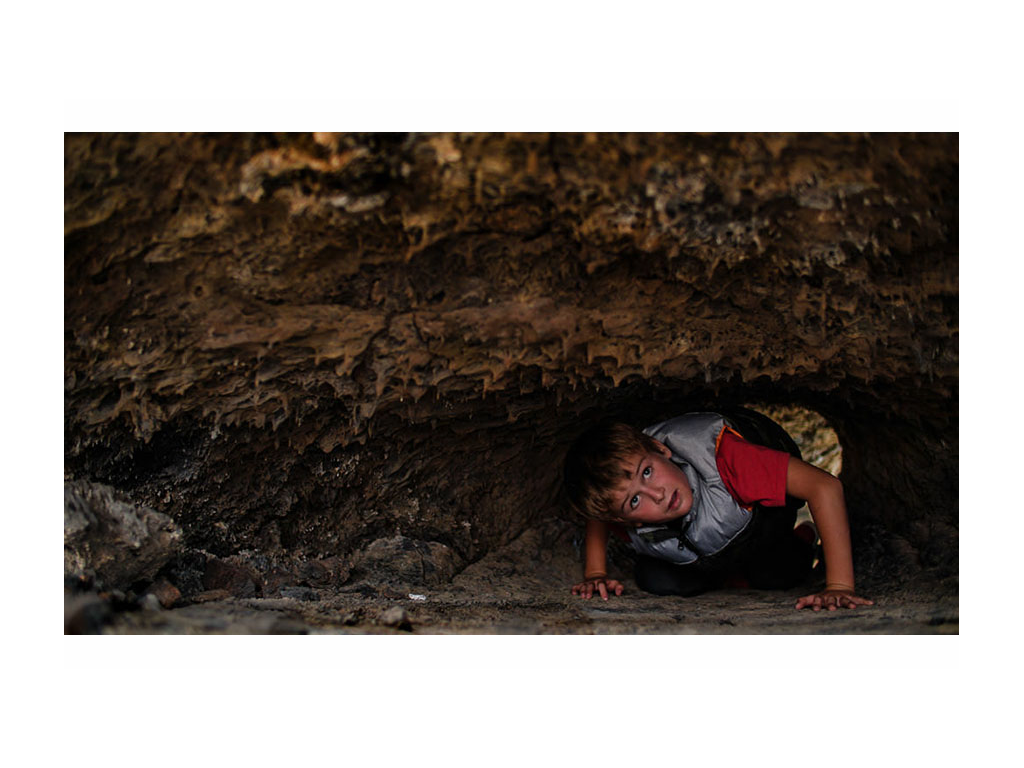 Dakota exploring the lava tubes in the park