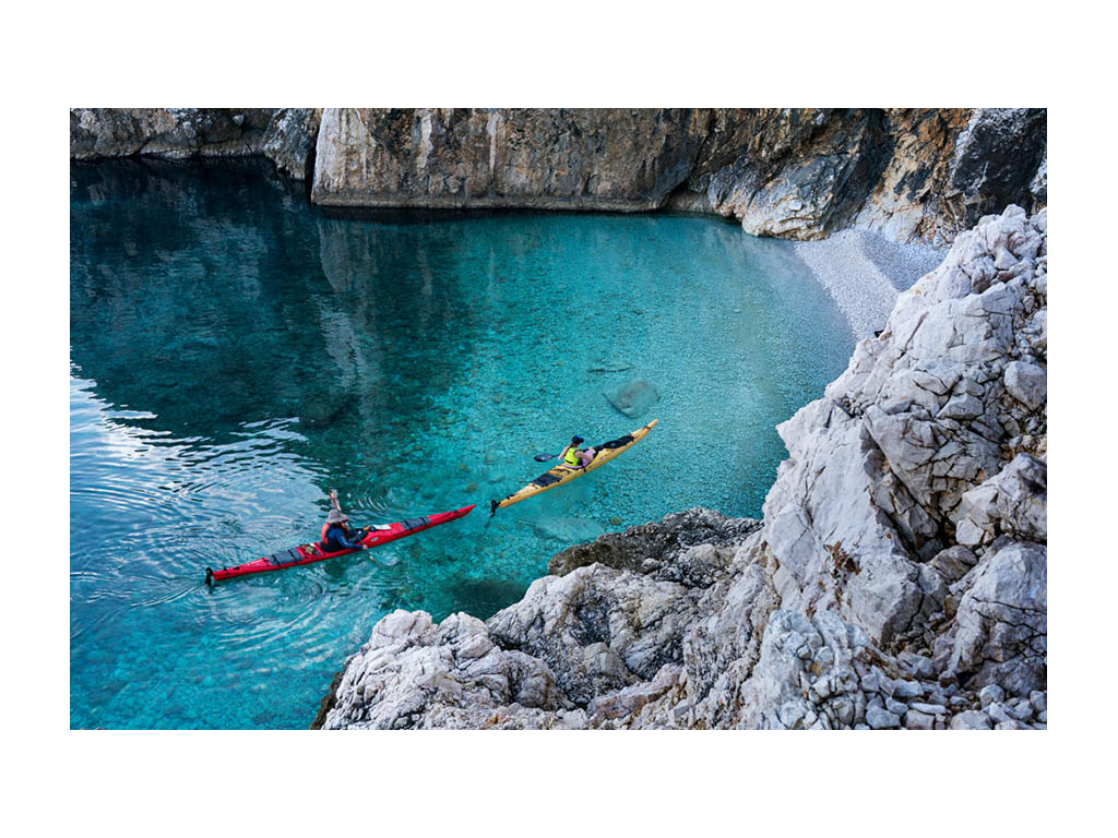 Kathy and Abby kayaking in blue waters of Croatia