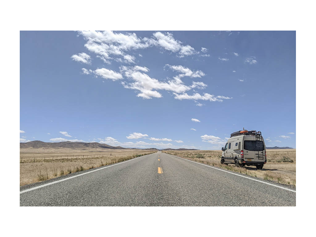 Revel parked on the side of an empty road