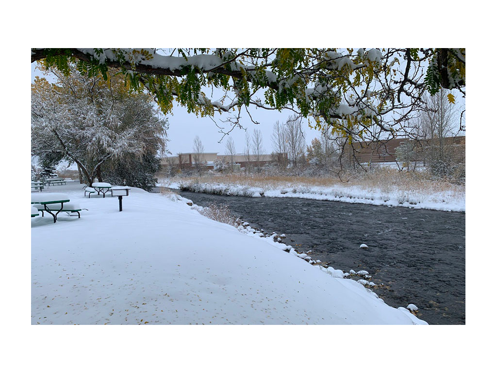Snowy campground property near river
