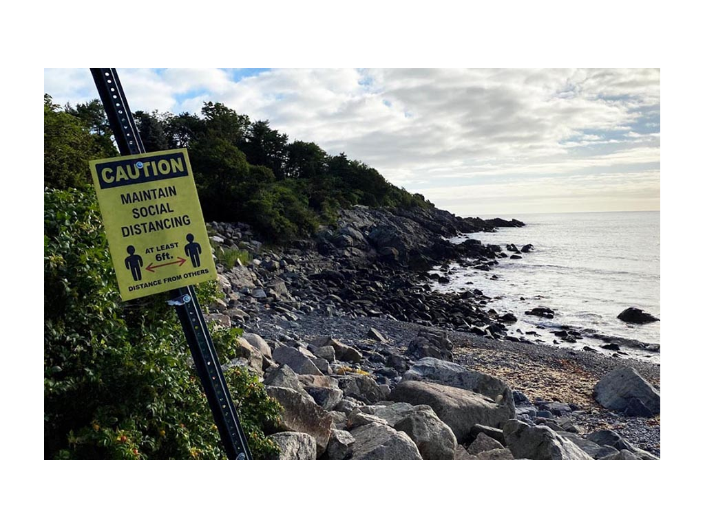 Social distancing sign on the beach